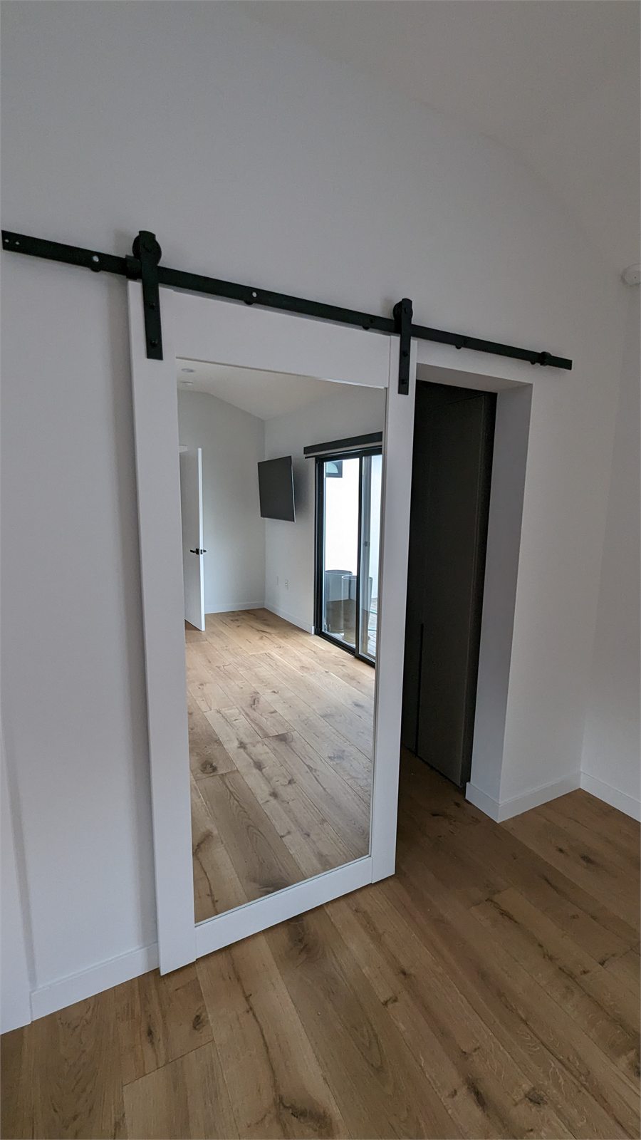 Custom sliding barn-door mirror installation